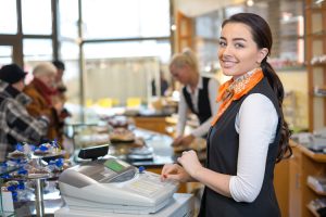 Restaurant Employee at Cash Register Representing Retailers Cash Shrinkage and Security